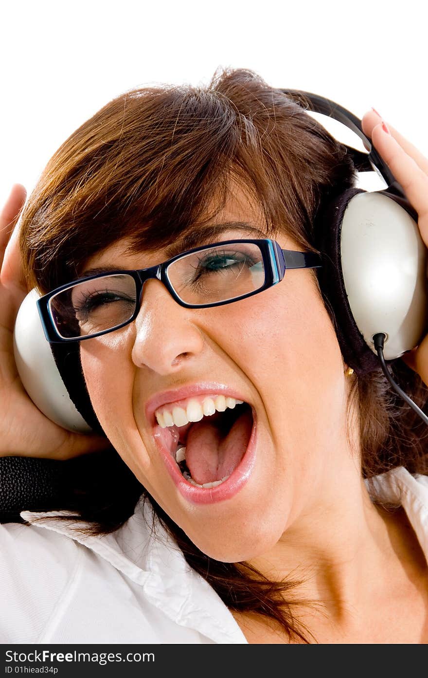 Close view of shouting woman listening music on an isolated white background