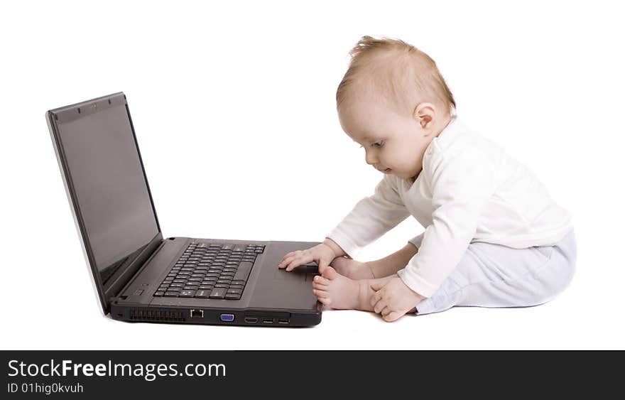 Little baby with laptop on white