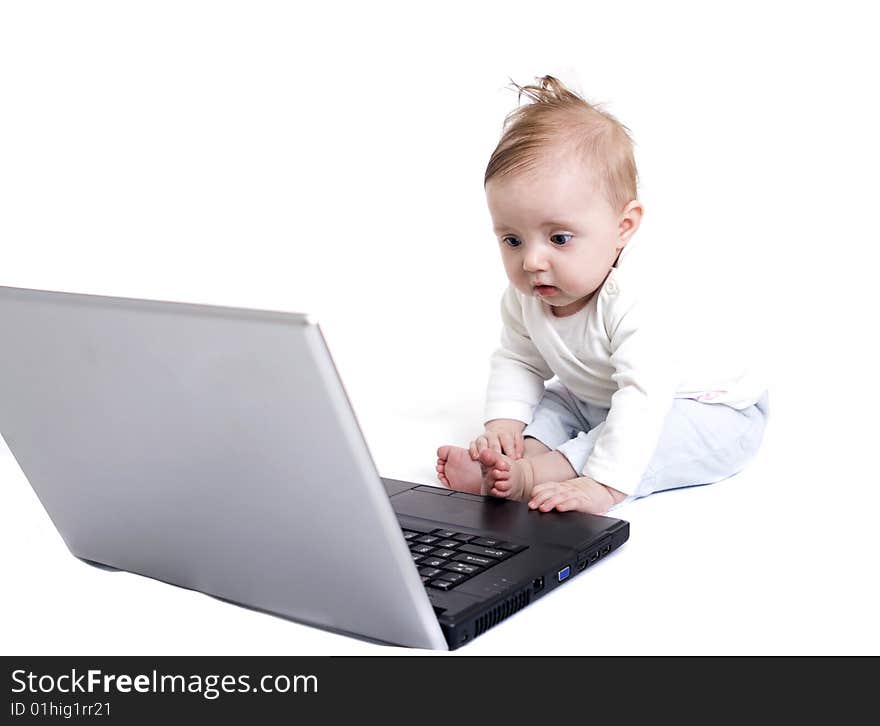 Little baby with laptop on white