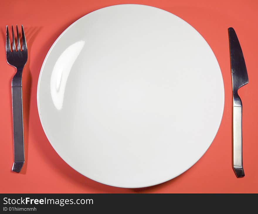 Single plate against red background. Single plate against red background