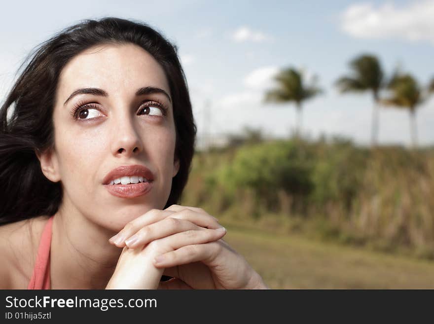 Beautiful young woman with beautiful eyes glancing away. Beautiful young woman with beautiful eyes glancing away