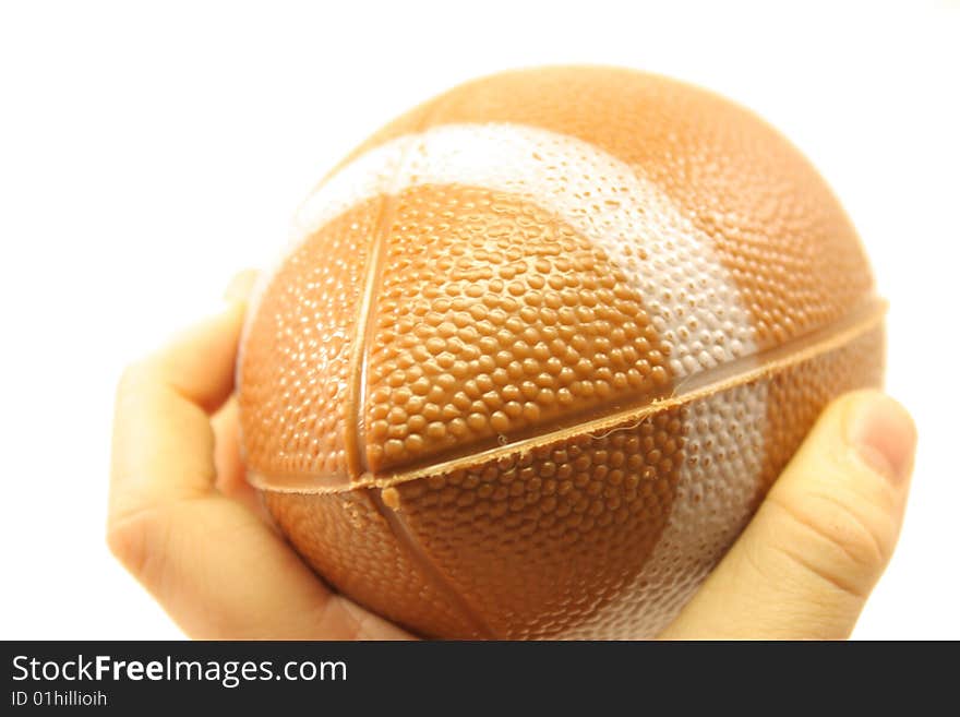 A close up of a child throwing a small football. A close up of a child throwing a small football.