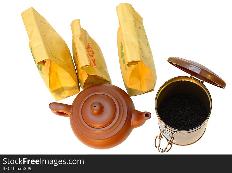 Chinese pottery (clay) teapot, tea in paper bags and tin on isolated background. Chinese pottery (clay) teapot, tea in paper bags and tin on isolated background.