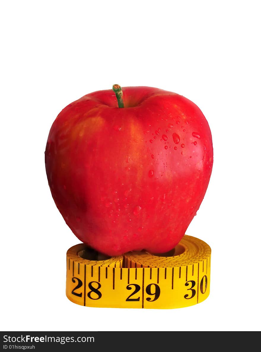 Depicted is a red apple on the measuring tape - isolated over white. Depicted is a red apple on the measuring tape - isolated over white