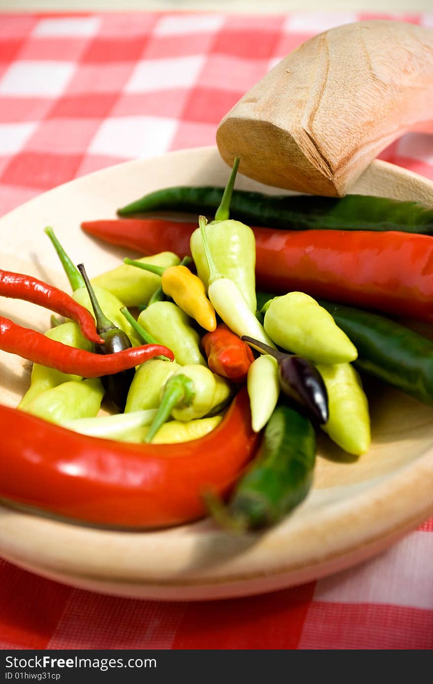 Chili pepper on wooden plate