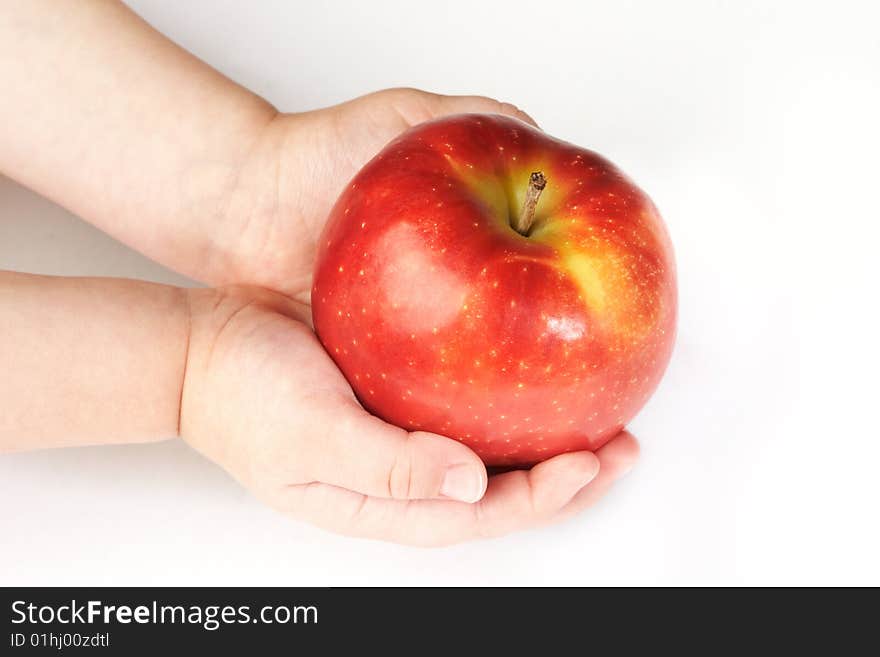 Fresh red apple on hands isolated on white background