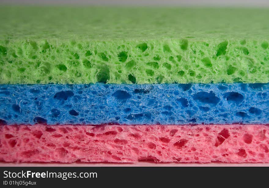 Close-up of 3 multicolor sponges for cleaning