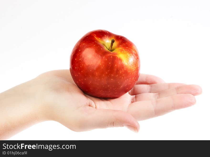 Fresh red apple on hand isolated on white background