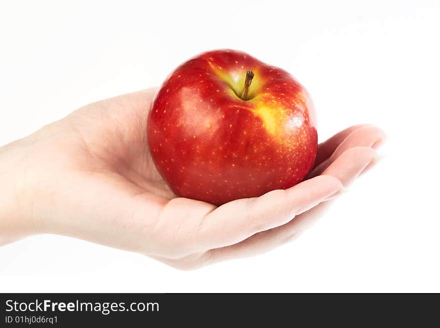 Fresh red apple on hand isolated on white background