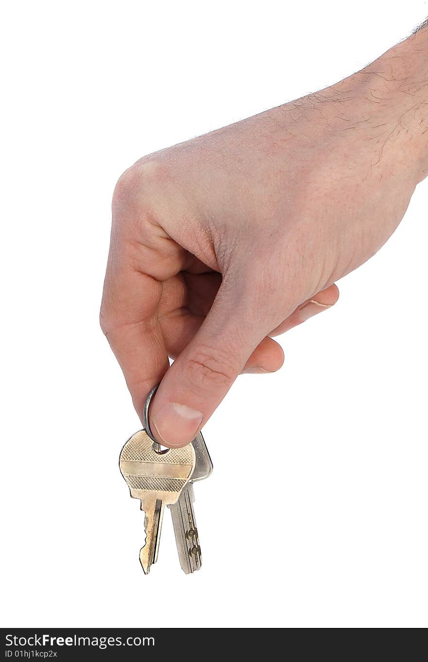 Hand holding metallic keys. isolated