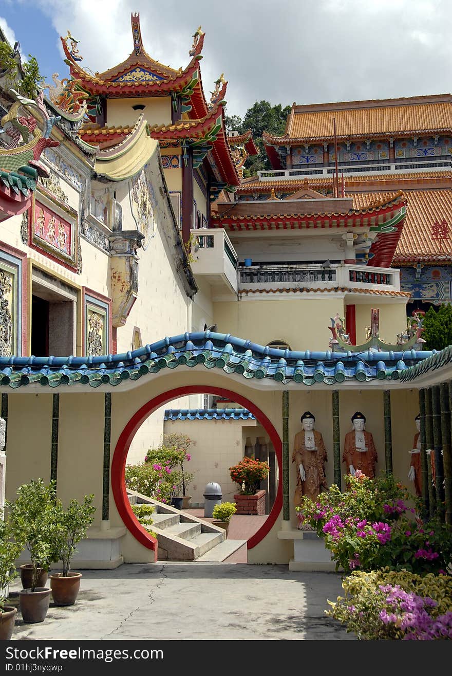 Beautiful doorway and sculptures of Buddha in an asian Temple