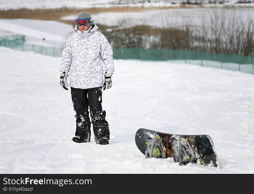 Young adult male snowboarder