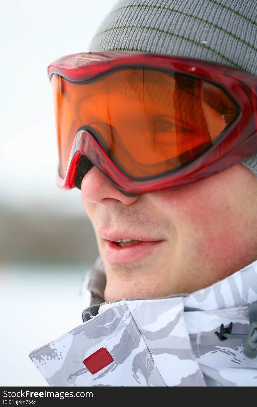 Snowboarder looking in goggles