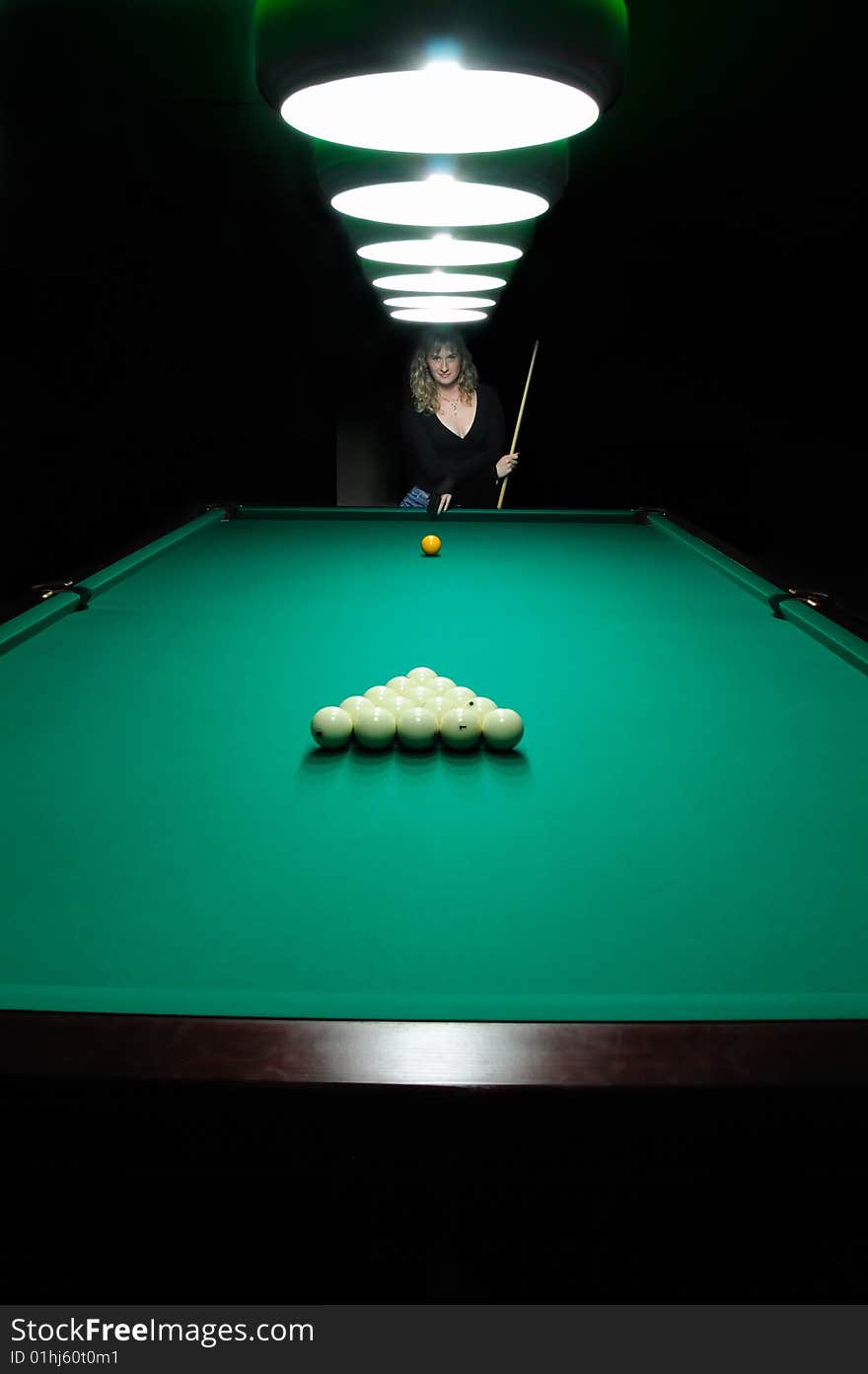 The girl suggests to play billiards. The girl suggests to play billiards