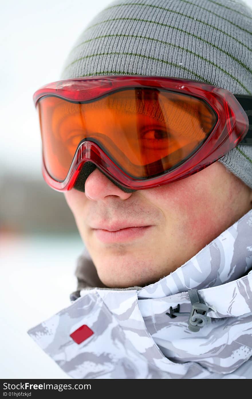 Snowboarder looking in goggles