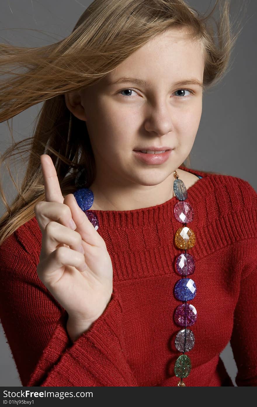 Teenager showing the finger demonstrative