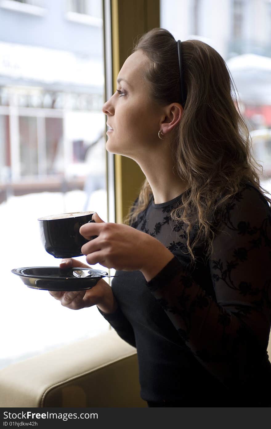 Woman with the cup of the coffee. Woman with the cup of the coffee