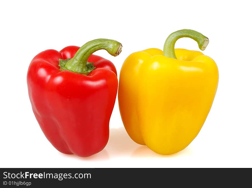 Couple of fresh peppers isolated on white