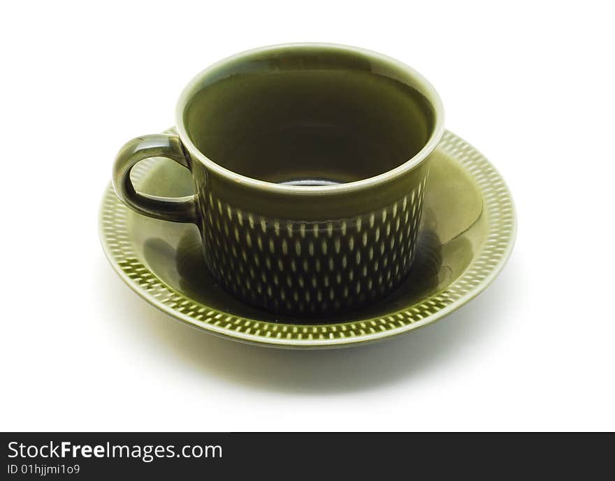 Green cup with plate isolated on white