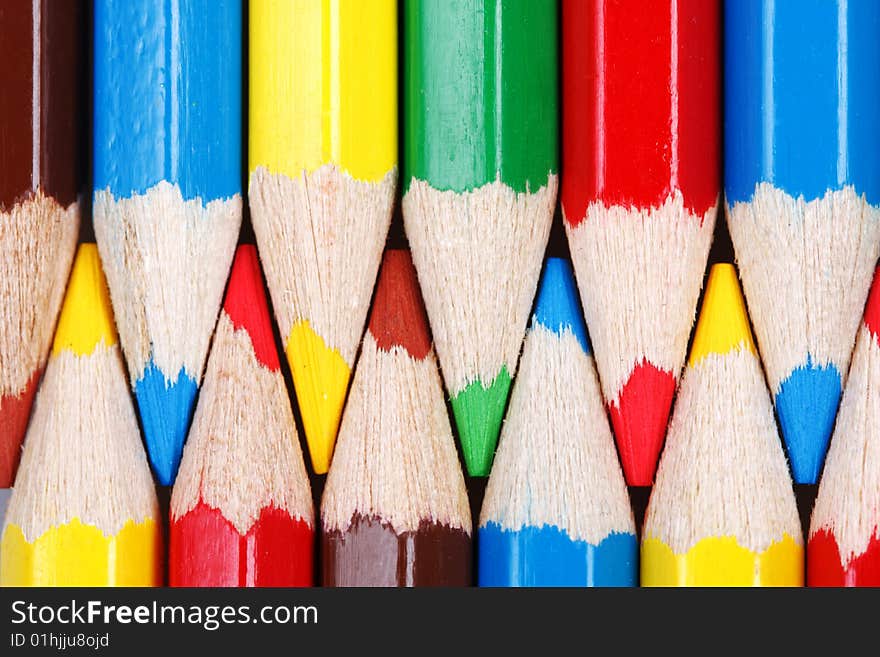 Two rows of colored pencils, macro