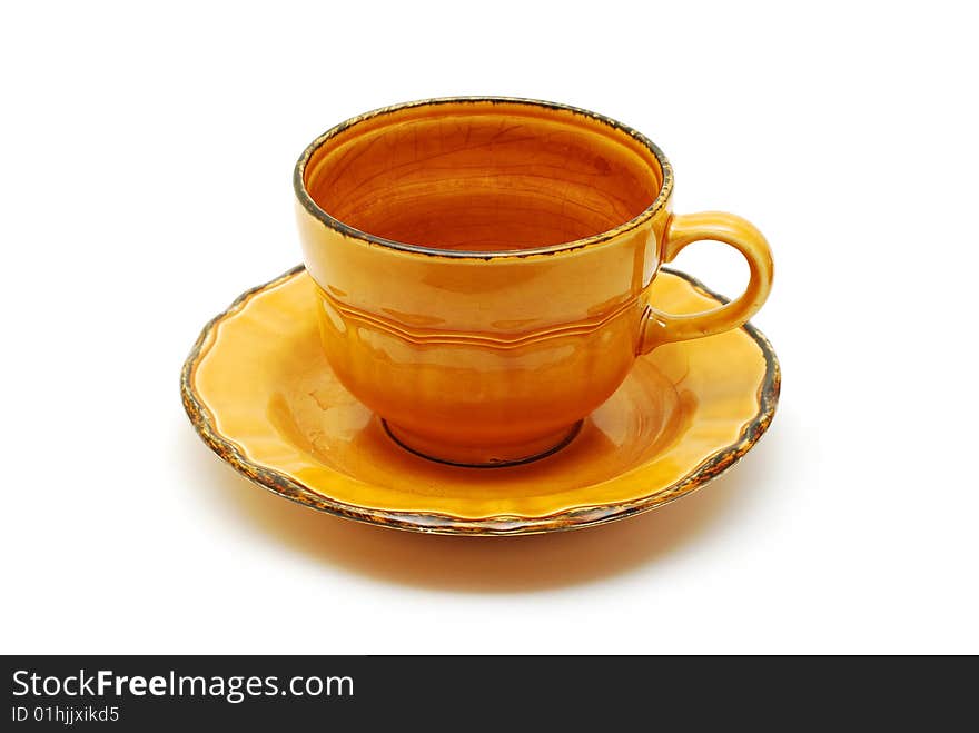 Orange cup with plate isolated on white