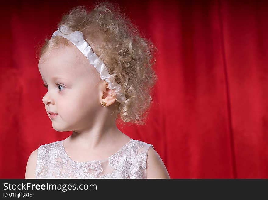 Cute little girl in  a white dress