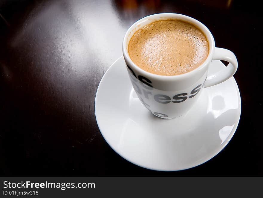 White coffee cup on a wood table