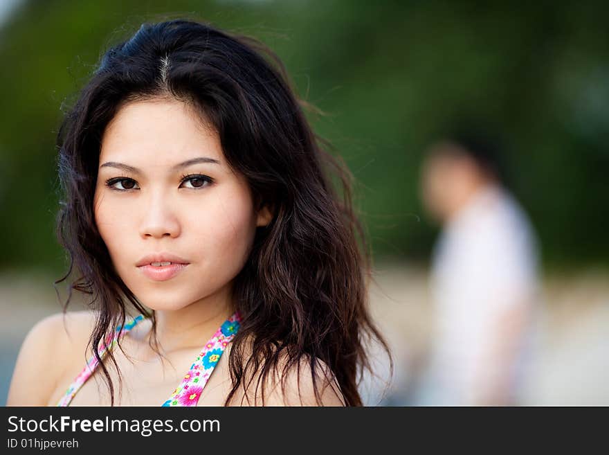 Young woman relaxing by the summer beach. Young woman relaxing by the summer beach