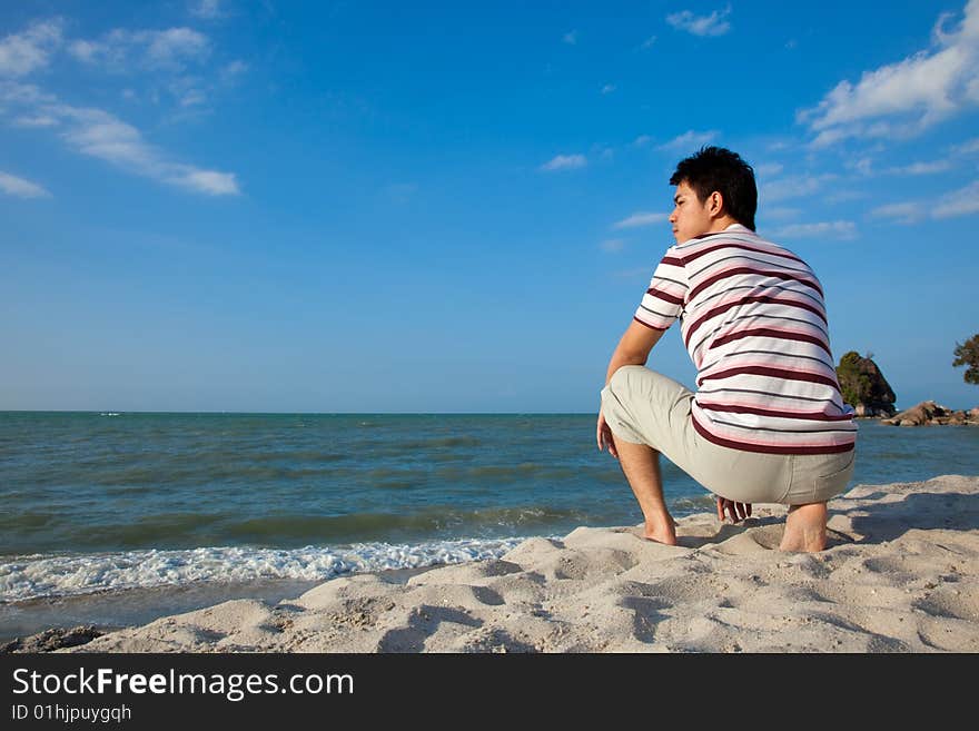 Young man by the beach