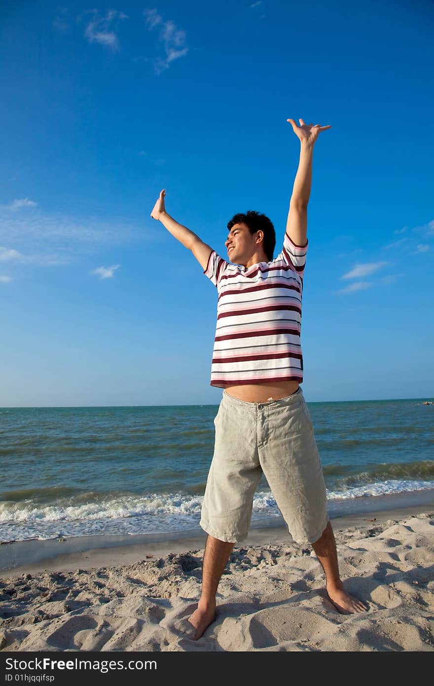 Excited young man having fun at beach. Excited young man having fun at beach