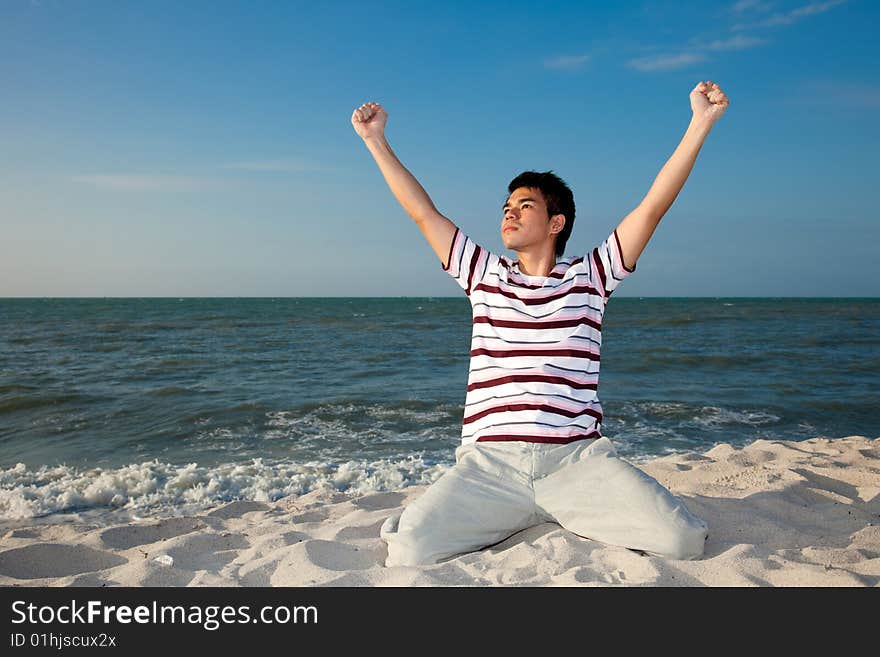 Excited young man having fun at beach. Excited young man having fun at beach