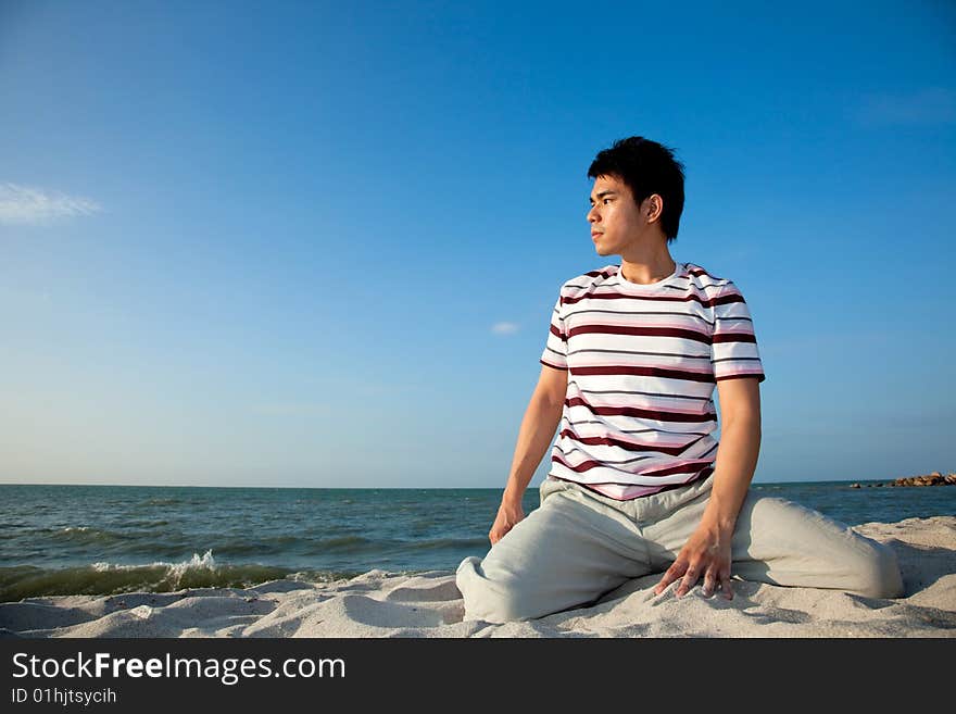 Young man by the beach