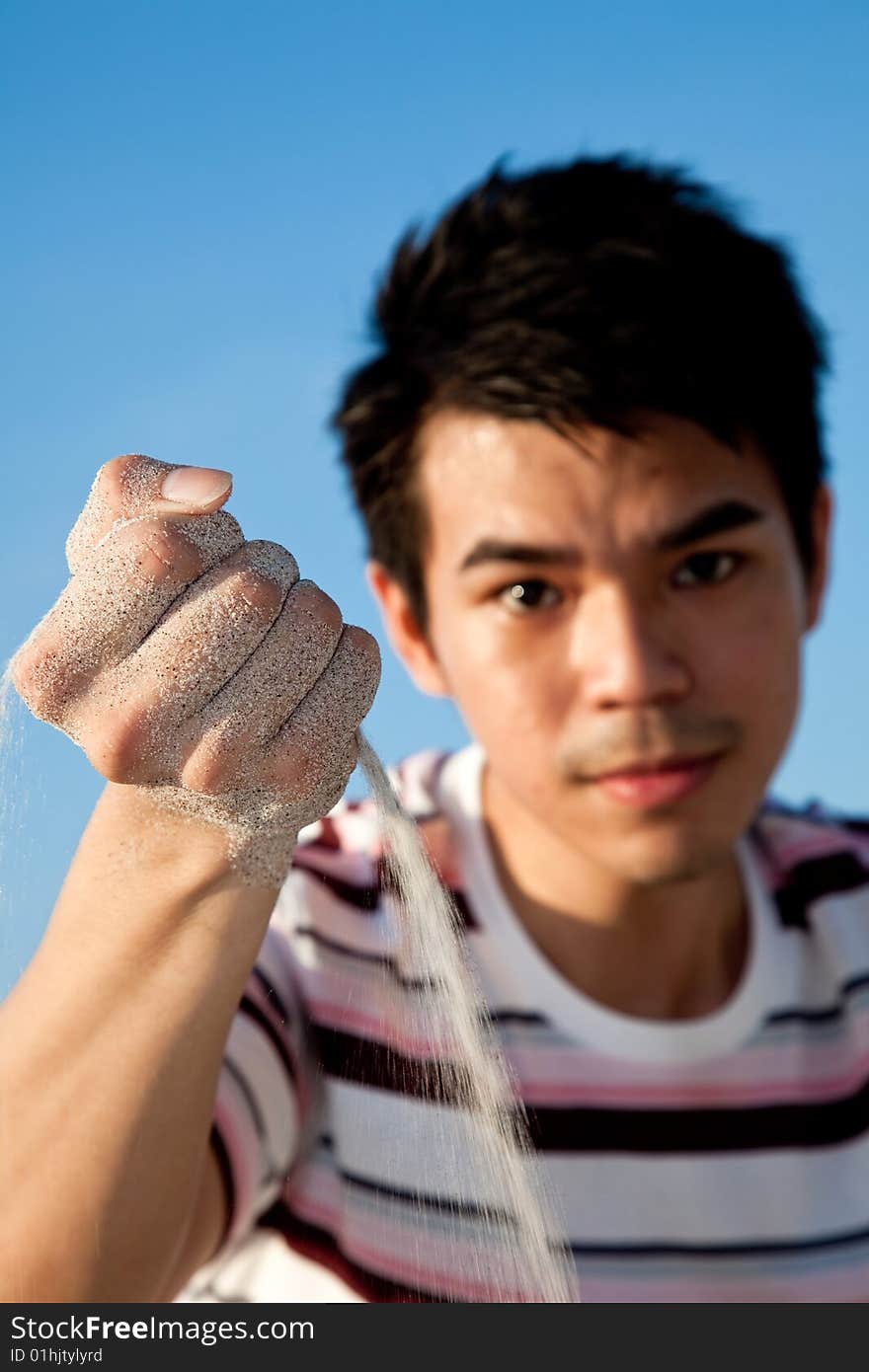 Young man by the beach