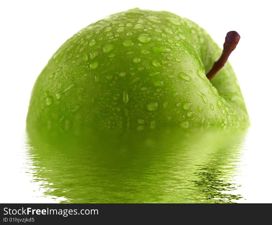 Green apple with water drops and reflection. Very high detail texture.