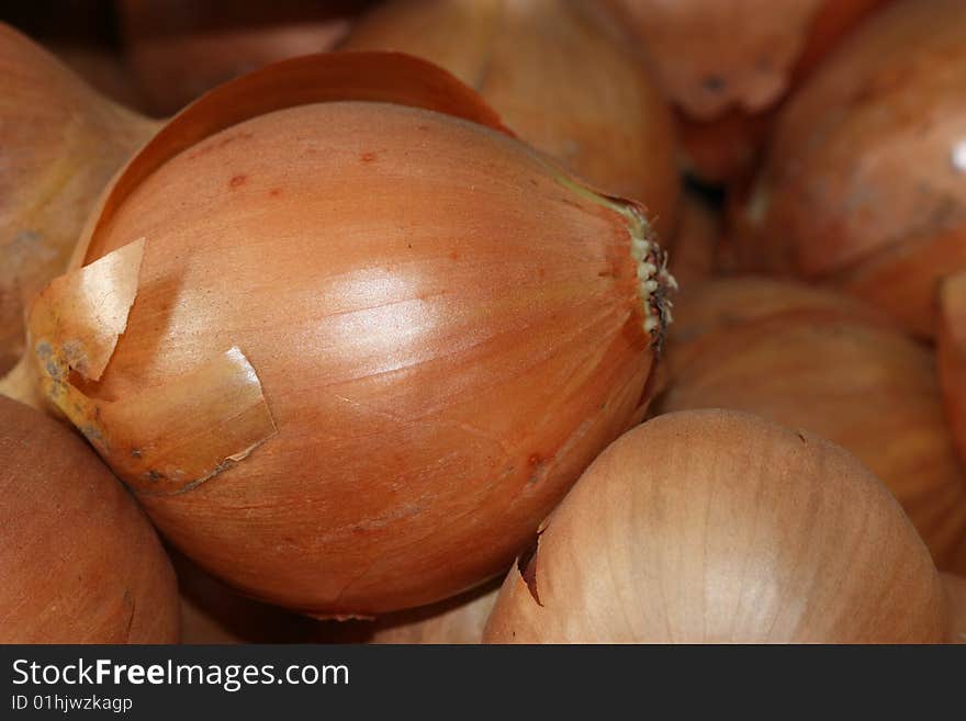 Several onions compounding on the pile