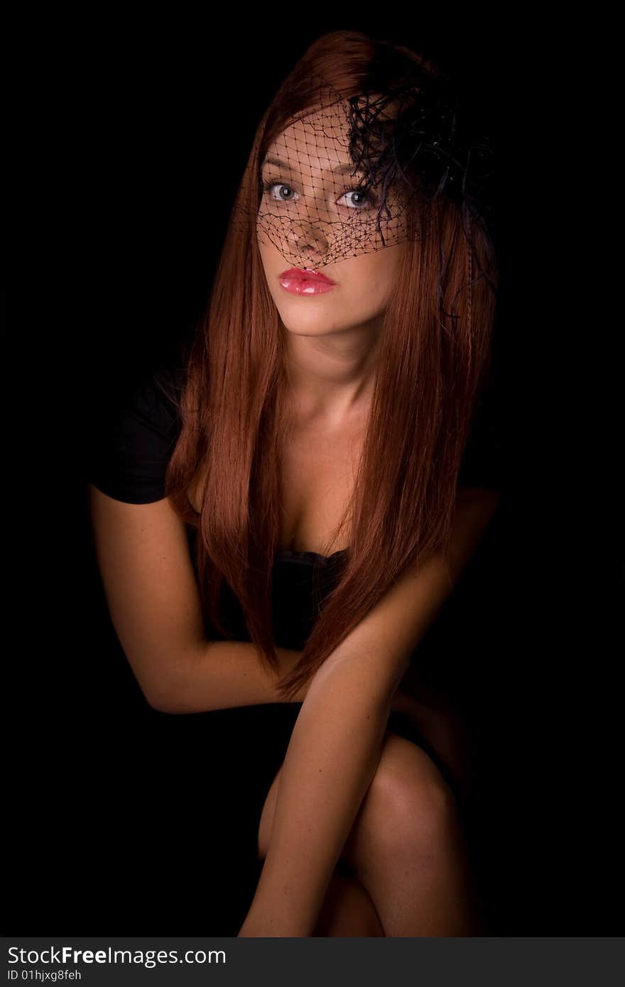 Beautiful young woman with red hair