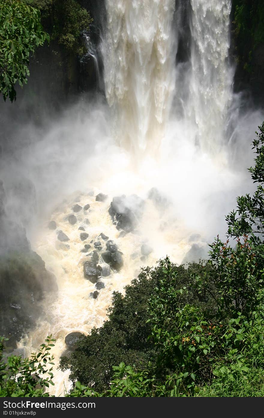 Beautiful waterfall in Africa, water is coming down very fast.