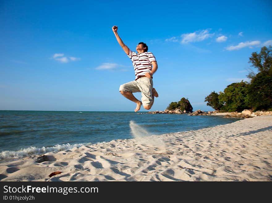 Excited young man having fun at beach. Excited young man having fun at beach