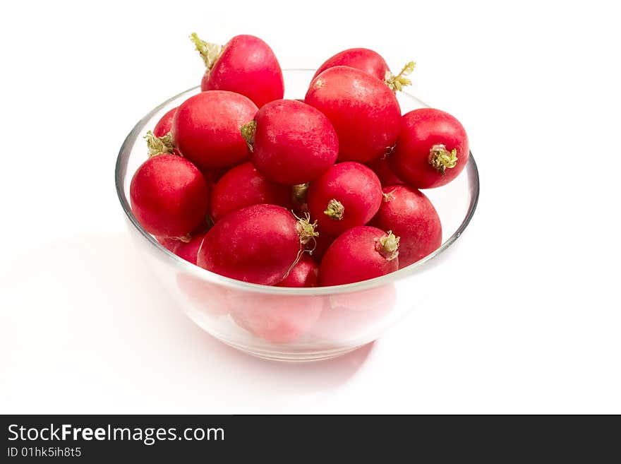 Plate of red radish vegetables isolated on white background