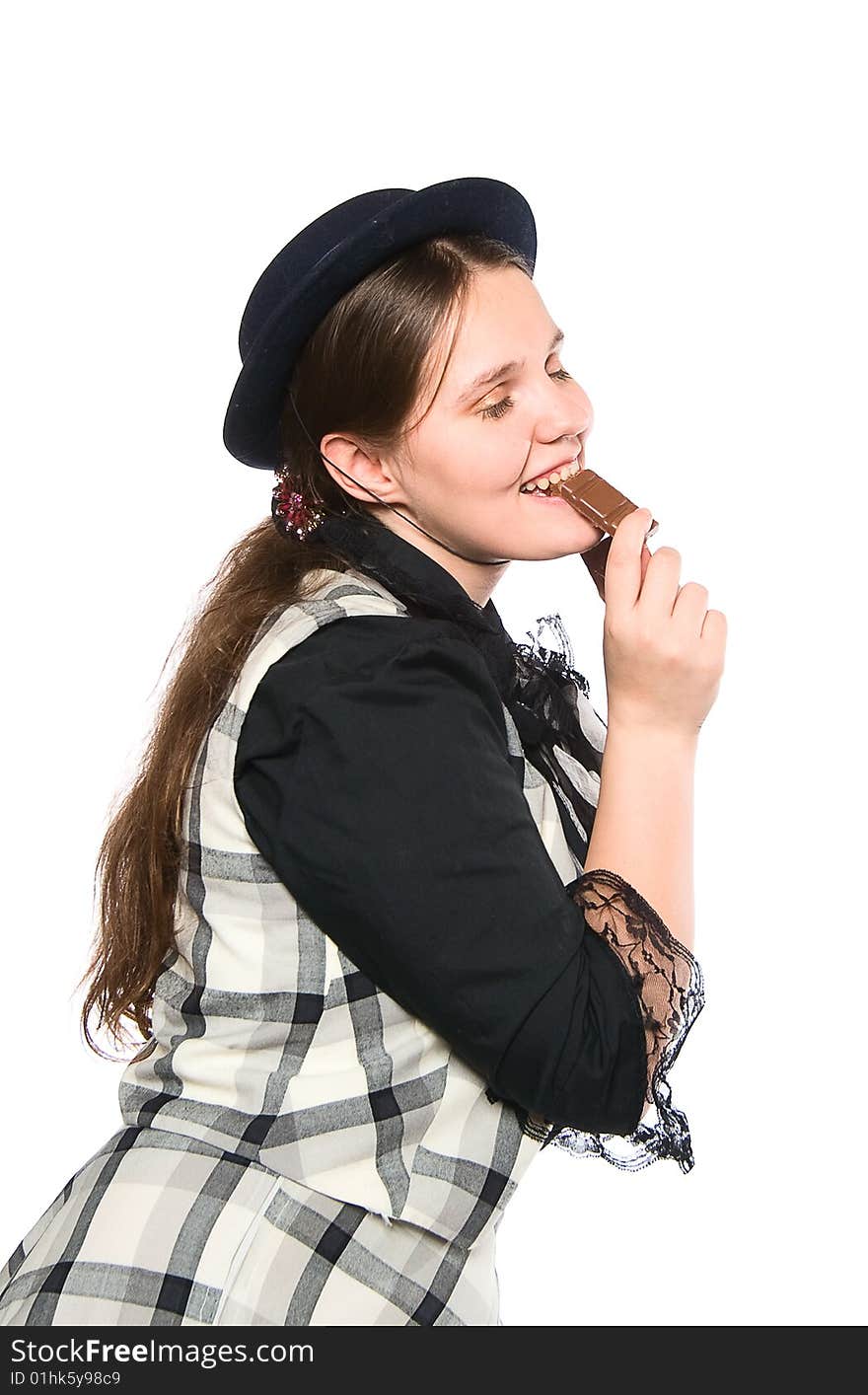 Beautiful girl eating a piece of chocolate. Beautiful girl eating a piece of chocolate