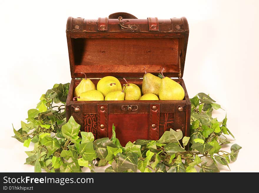 An array of pears in an old small chest. An array of pears in an old small chest