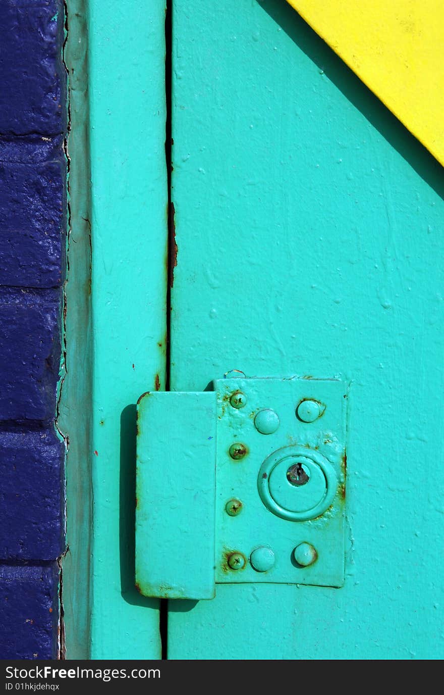 Colorful exterior door lock on an urban building.