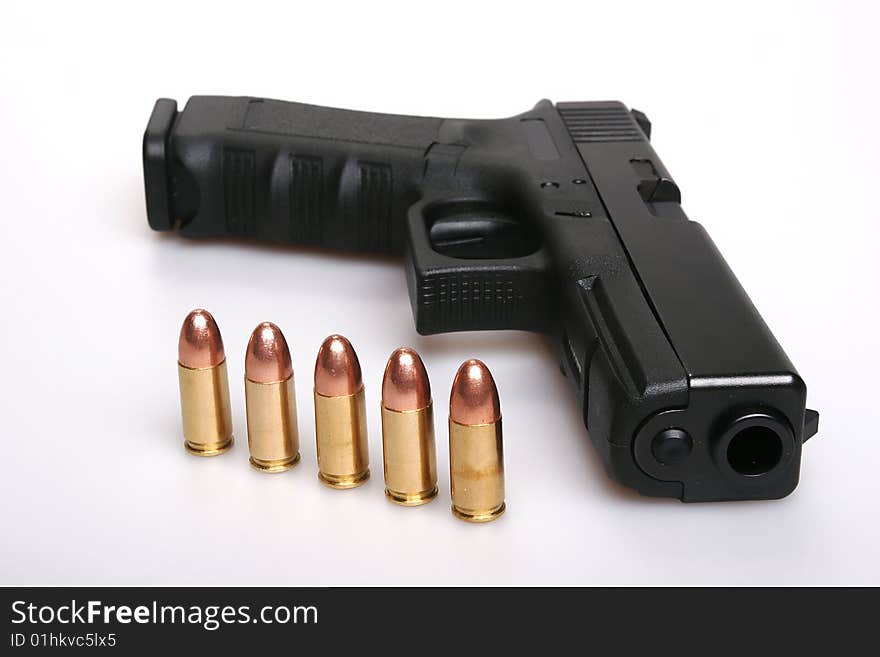 Black glock gun and bullets isolated on white background