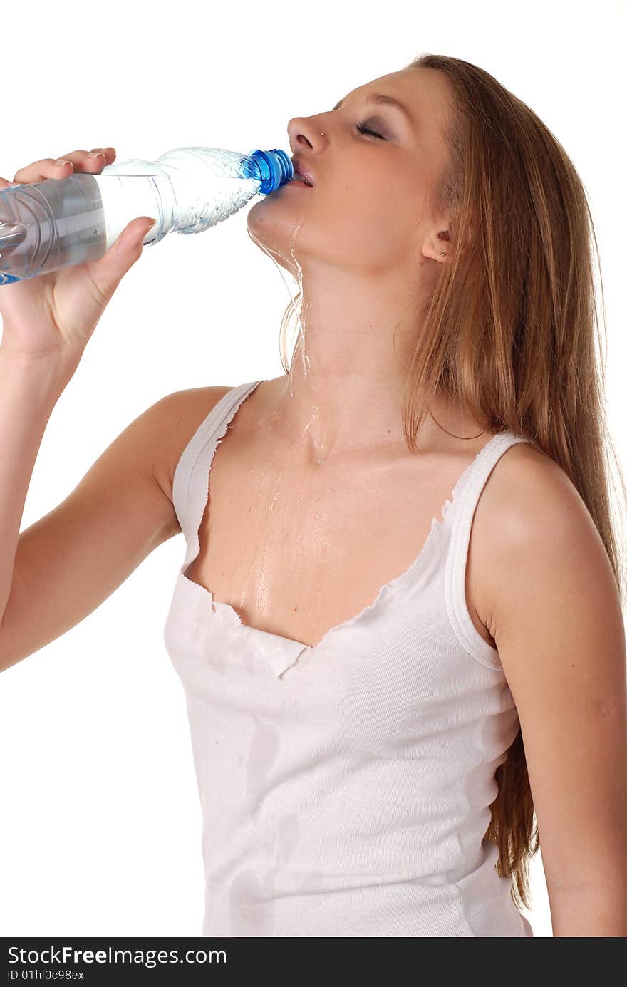 Woman in wet white shirt with bottle of water. Woman in wet white shirt with bottle of water