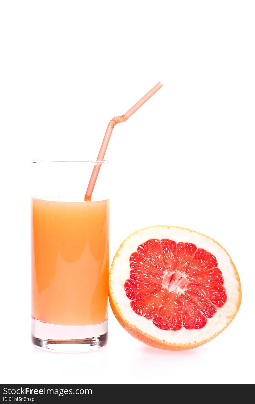 Grapefruit and juice in glass on a white background