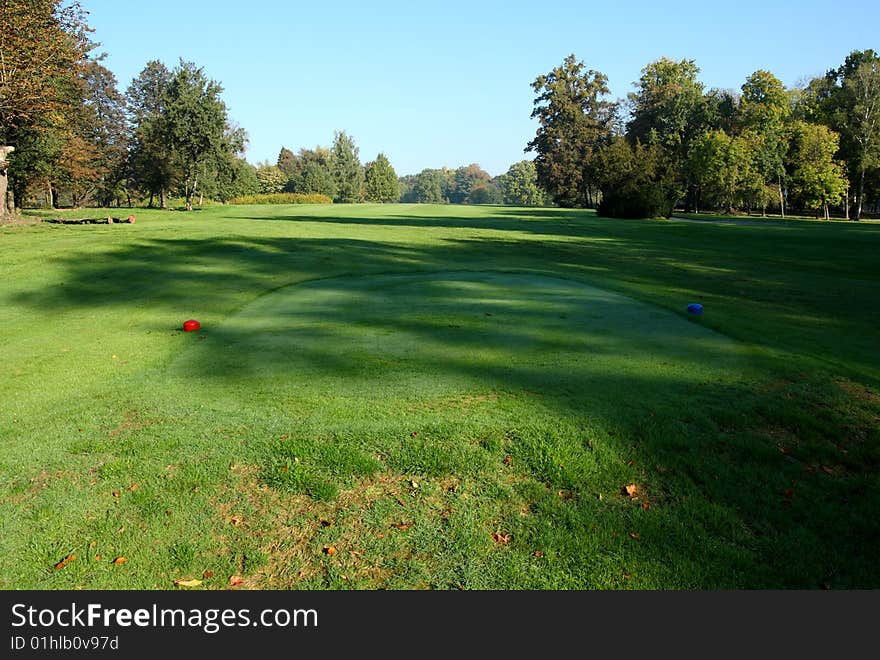 Summer day in park on a neat golf course