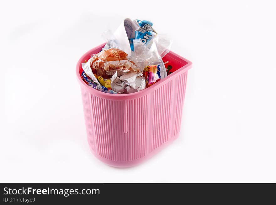 Full pink recycle bin isolated on white