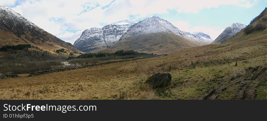 Panoramic shot of the mountains near Glen Coe, where the MacDonald massacre happened in 1692. Panoramic shot of the mountains near Glen Coe, where the MacDonald massacre happened in 1692