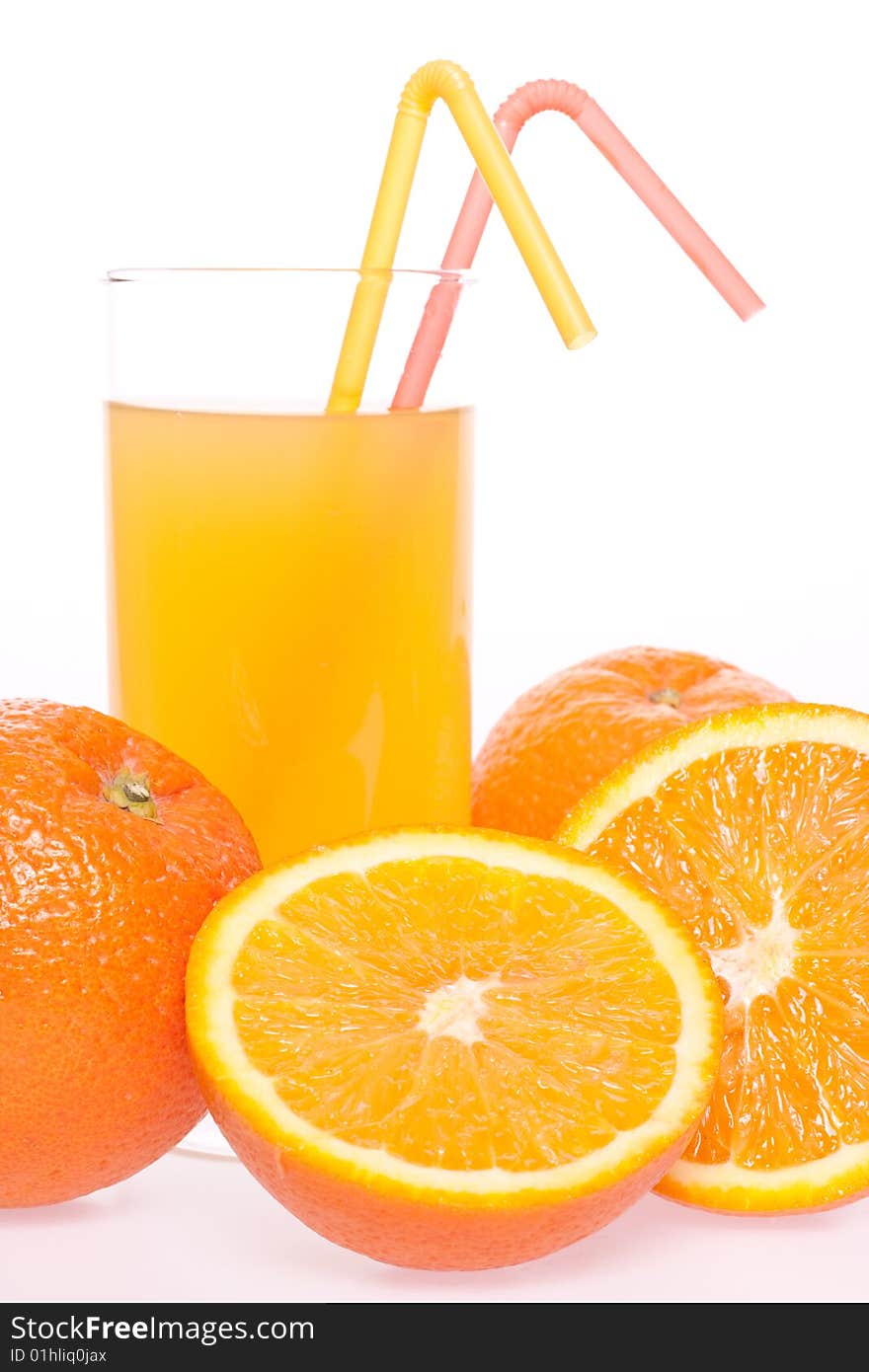 Orange and juice in glass on a white background