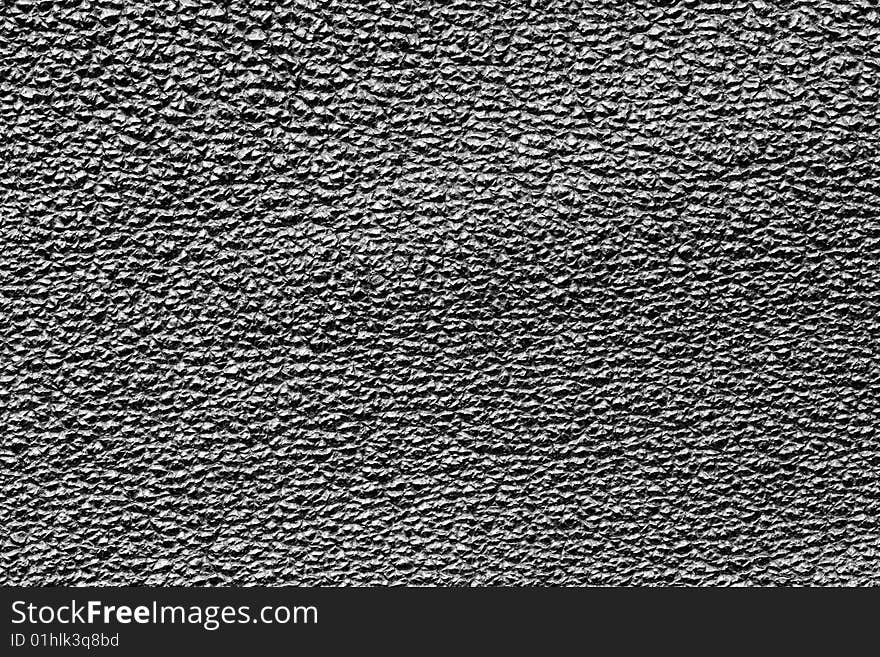 A close-up of the texture of black leather. A close-up of the texture of black leather